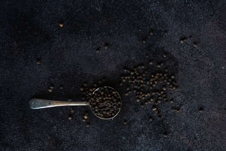 Cooking concept with pepper spice on dark background with copy spaceの写真素材