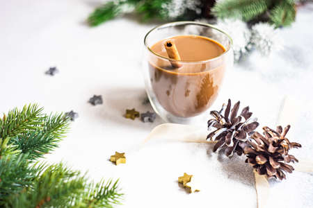 Glass of coffee with milk and spices on stone background with copy spaceの写真素材