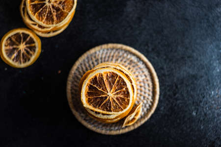 Dried orange fruit on dark background with copy spaceの写真素材