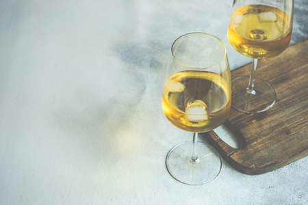 Glass of white Rkatseteli wine on rustic background with copy spaceの写真素材