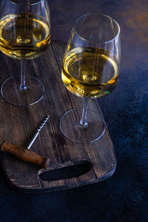 Glass of white Rkatseteli wine on rustic background with copy spaceの写真素材
