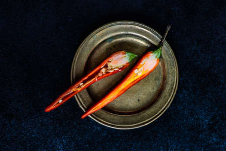 Red hot chille pepper on rustic background with copy spaceの写真素材