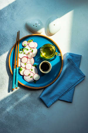 Organic radish salad in asian style on stone background with copy spaceの写真素材