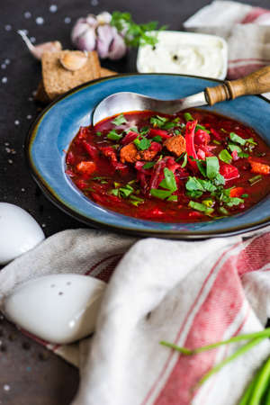 Traditional ukrainian beetroot soup borscht on stone background with copy spaceの写真素材