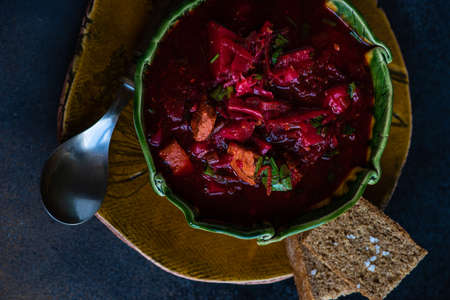 Traditional ukrainian beetroot soup borscht on stone background with copy spaceの写真素材
