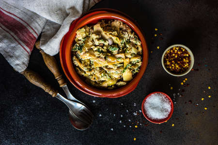 Traditional georgian summer lobio dish with  french beans with eggs and herbs on stone background with copy spaceの写真素材