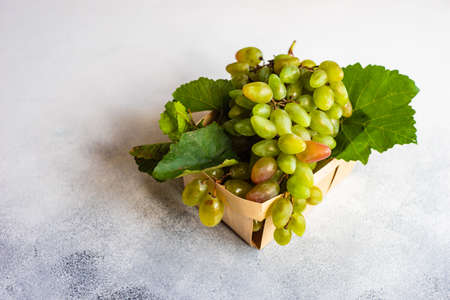 Organic food concept with variety of ripe grape on stone background with copy spaceの写真素材