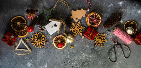 Christmas card concept with holiday decor on grey concrete background with copy space