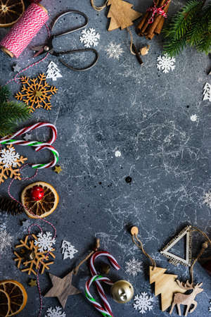 Christmas card concept with holiday decor on grey concrete background with copy spaceの写真素材