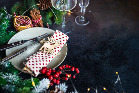 Table setting for festive holiday Christmas dinner on stone  background with copy spaceの写真素材