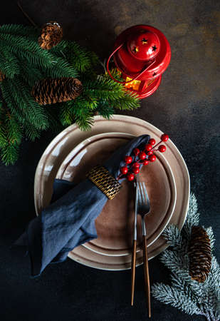 Table setting for festive holiday Christmas dinner on stone  background with copy spaceの写真素材