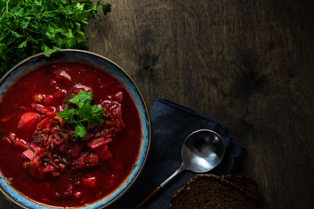 Traditional ukrainian beetroot soup borscht on stone background with copy spaceの写真素材