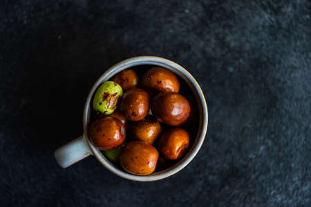 Traditional georgian fruit  jujube on dark stone background with copy space
