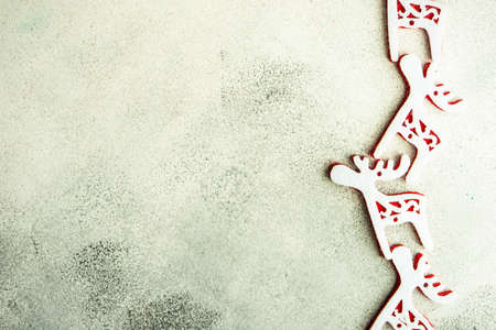 Christmas frame with holiday decor on white and grey stone background with copy spaceの写真素材