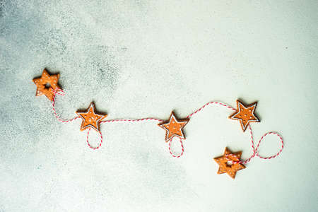 Christmas frame with holiday decor on white and grey stone background with copy spaceの写真素材