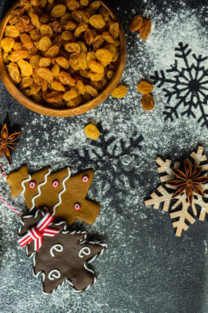 Christmas cooking concept with cookies cutters on stone background with copy space