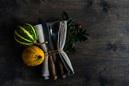 Autumnal table setting with ripe pupking for Thanksgiving holiday dinnerの写真素材