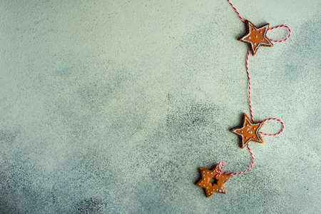 Christmas frame with holiday decor on white and grey stone background with copy spaceの写真素材