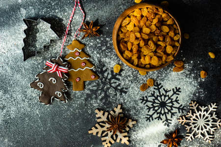 Christmas cooking concept with cookies cutters on stone background with copy spaceの写真素材
