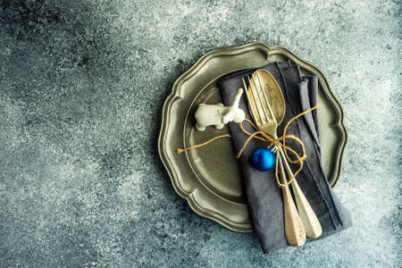 Table setting for festive Christmas dinner on stone table with copy spaceの写真素材