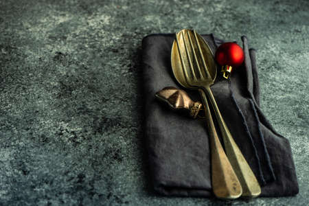 Table setting for festive Christmas dinner on stone table with copy spaceの写真素材
