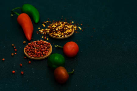 Cooking concept with hot chilli pepper on stone background with copy spaceの写真素材