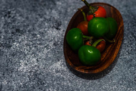 Cooking concept with hot chilli pepper on stone background with copy spaceの写真素材