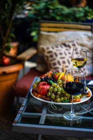 Fresh fruits and wine on the table during the Tbilisoba celebrationの写真素材