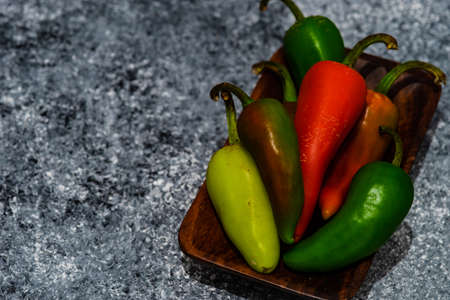 Cooking concept with hot chilli pepper on stone background with copy spaceの写真素材
