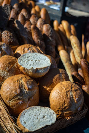 Bakery concept with gold rustic crusty loaves of bread and buns
