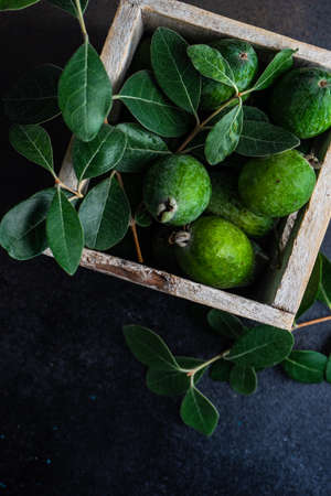Fresh feijoa fruits in the basket are ready for eatingの写真素材