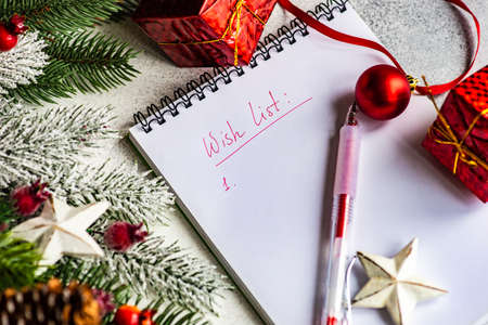 Christmas frame concept with fir tree, cones and holiday decor on stone background with copy spaceの写真素材