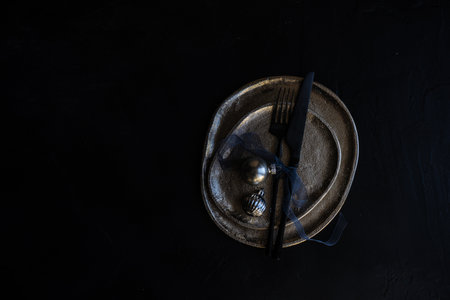 Christmas table setting with decor and cutlery on stone background with copy spaceの写真素材