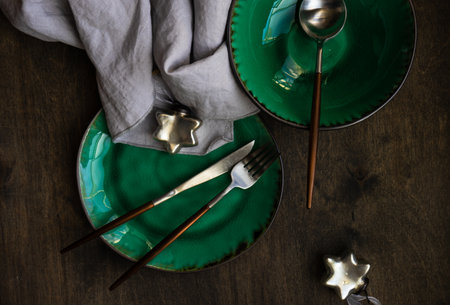 Rustic table setting for festive holiday Christmas dinner with decor on wooden  background with copy...
