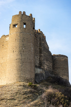 27 NOVEMBER 2019, KSANI, GEORGIA: Ruins of famous medieval castle Qsnis tsikhe on hill top over Ksani townのeditorial素材