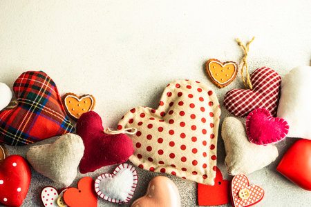 Valentine day holiday card concept with heart shaped decor on stone background with copy space