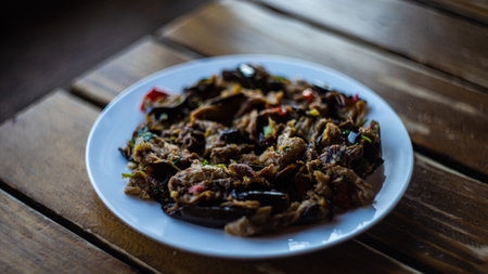 Traditional georgian  eggplant dish with vegetable served on a cafe tableの写真素材