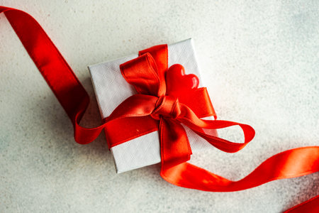 Valentine day holiday card concept with gift boxes on stone background with copy space