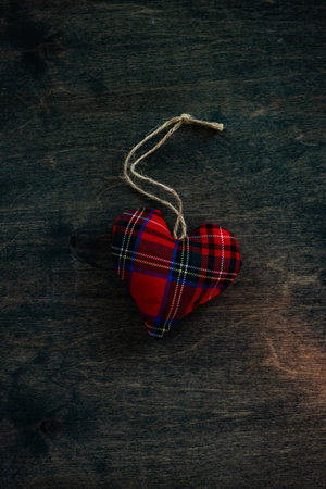 St. Valentine card concept with heart shaped decor on wooden background with copy spaceの写真素材