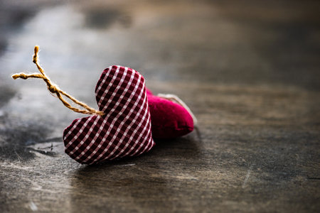 St. Valentine card concept with heart shaped decor on wooden background with copy spaceの写真素材