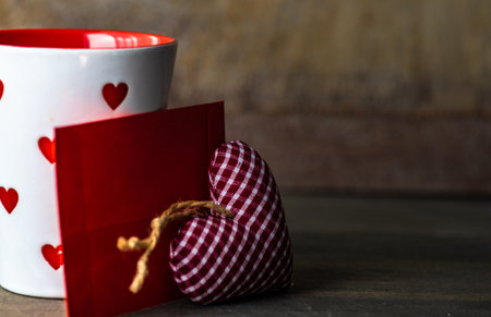 St. Valentine card concept with heart shaped cookies and cup of coffee on stone white background with copy spaceの写真素材
