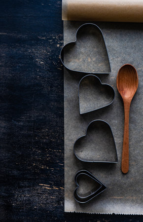Cookies bake concept for holiday St. Valentine Day on wooden background with copy spaceの写真素材