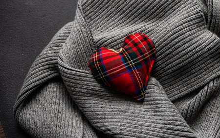 St. Valentine card concept with  hearts on knitted scarf with copy spaceの写真素材