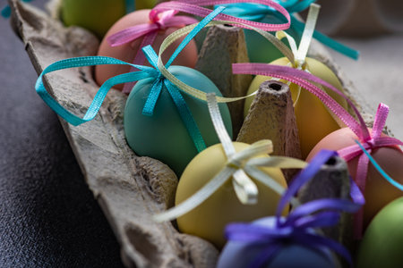Easter card concept with colored eggs on stone background with copy space