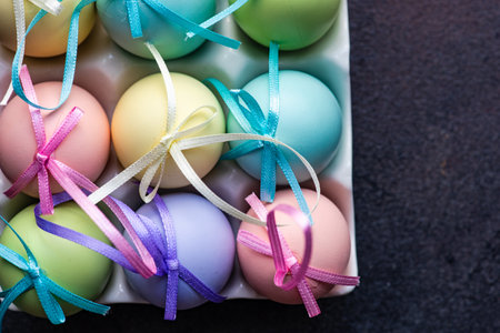 Easter card concept with colored eggs on stone background with copy space