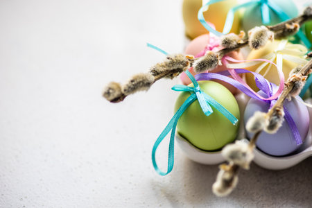 Easter card concept with colored eggs on stone background with copy space