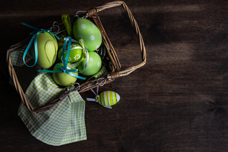 Easter card concept with eggs on rustic wooden background with copy spaceの写真素材