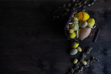 Easter card concept with eggs on rustic wooden background with copy space