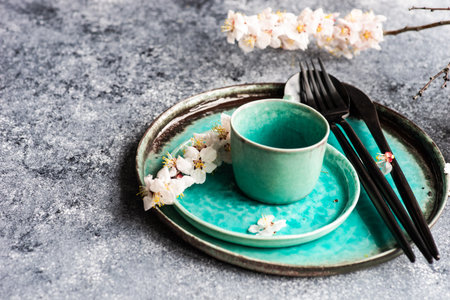 Table setting with modern cutlery on concrete background with copy spaceの写真素材