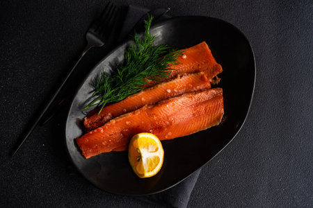 Healthy eating concept with herring fish with dill and lemon served on plate